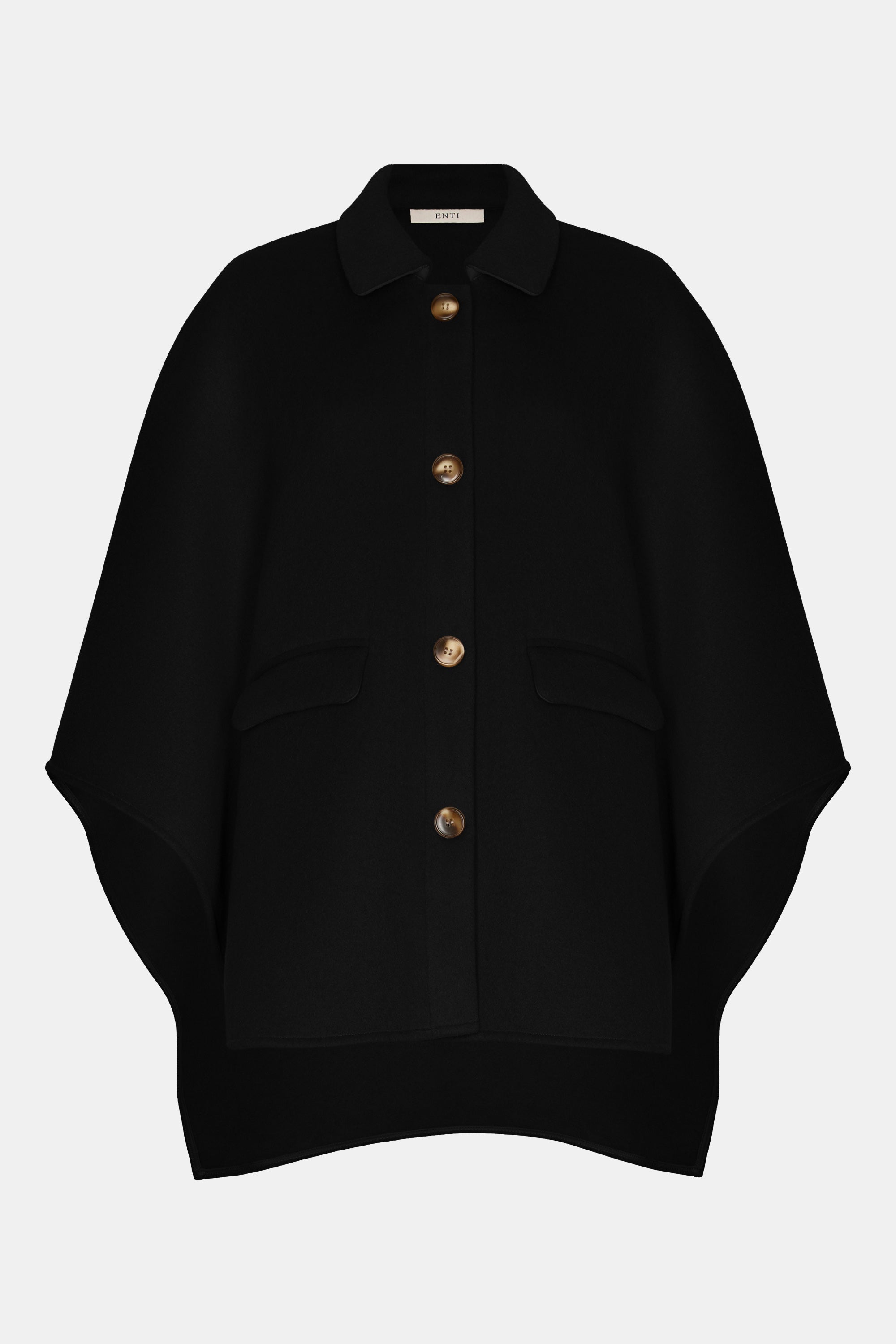 mannequin van de wollen poncho van het modest merk enti in de kleur zwart